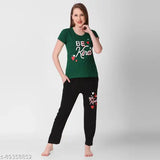 Green and white long sleeve top with matching pajama pants, featuring the message "Be Kind" on a heart design