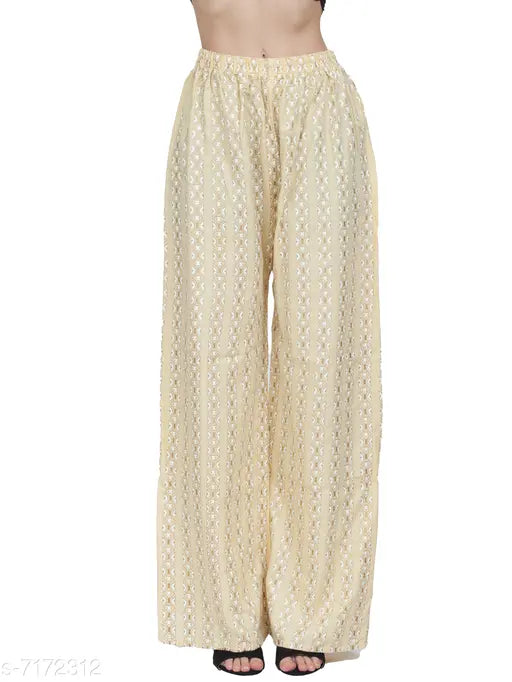 Women's rayon yellow palazzo kurta set with three-quarter sleeves, printed net pattern on display
