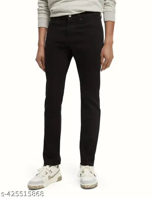 Slim black denim jeans for men by Koetler. Stretchable and washable with button & zip closure, available in sizes 28, 30, and 32