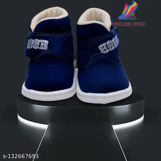 Navy blue velvet children's shoes with white soles and whistle feature, zip closure