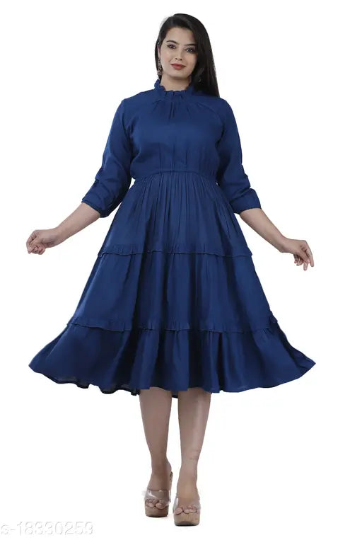 Dark blue ruffled midi dress with 3/4 length sleeves, knee length skirt