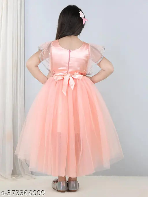 Peach net children's dress with toy balloon print, suitable for parties, sizes range from 1-11 years old, made in India