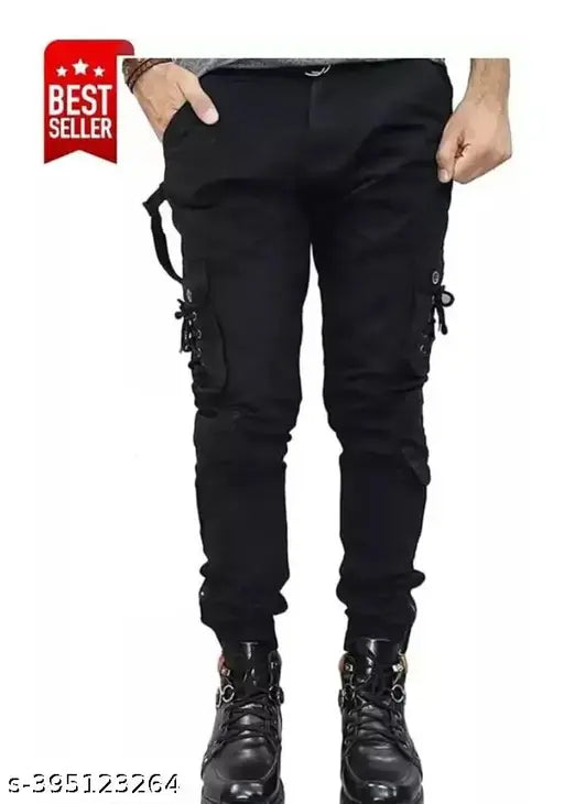 Black cotton blend cargo jeans by Fikow for men, solid design with flaying details. Size: 30 (waist 30in, length 41in, hip 34in)