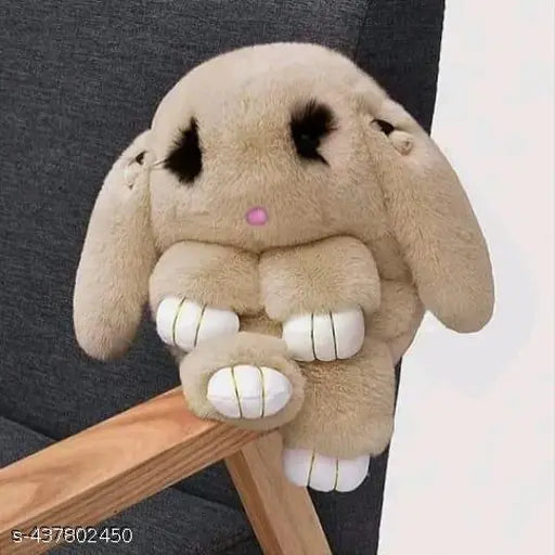 This is a plush bag in the shape of a cute rabbit, with a chain-crossbody strap, featuring a shoulder sling design that allows it to be worn as a backpack or on the shoulder. The bag appears multicolored and may contain multiple colors or patterns