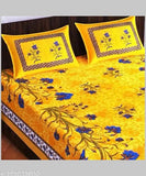 Yellow cotton double bed sheet with blue floral pattern & pillow.