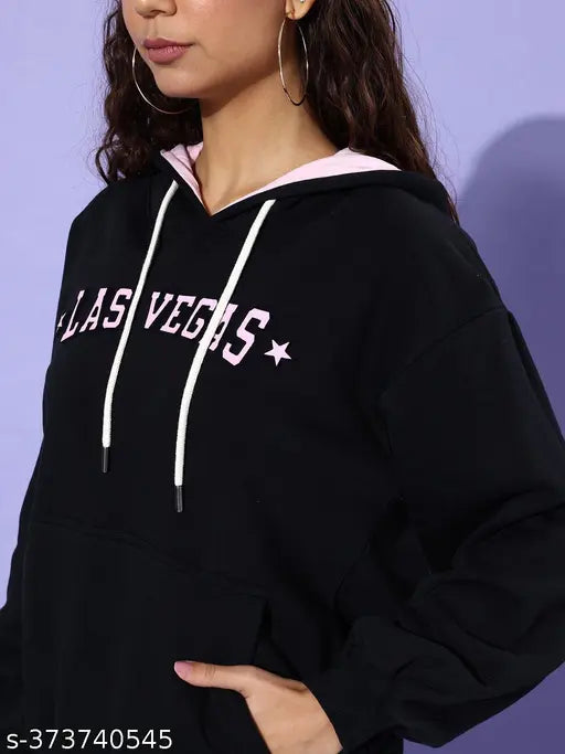 Black cotton oversized hooded sweatshirt with printed pattern, long sleeves and oversized fit