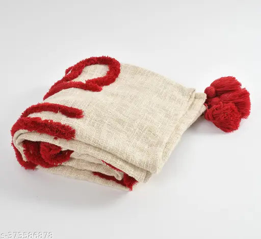 Handmade red and beige tufted throw blanket with tassels, soft cozy couch blanket for Christmas