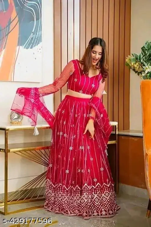 White net embroidered Lehenga Choli & Dupatta Set, semi-stitched. Traditional Indian bridal wear with a modern twist, featuring intricate embroidery and luxurious net fabrics