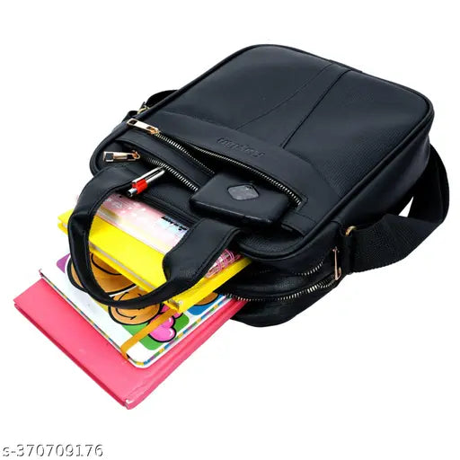 Black leather messenger bag with a strap, two pockets on the front, and a compartment inside