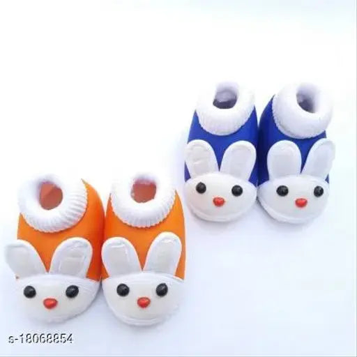 Blue and white baby booties with a playful cartoon bunny design