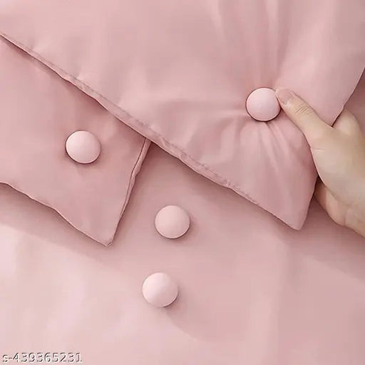 Pink comforter with 3 buttons, duvet clips for holding in place