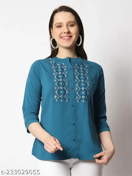 Green embroidered polyester top with three-quarter sleeves, unique Indian design by Prettify for women's fashion