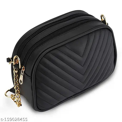 Black quilted sling bag with multiple pockets