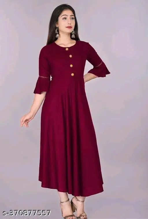 Maroon rayon solid flared kurti with three-quarter sleeves, hand wash or machine washable, suitable for casual and formal occasions, country of origin: India