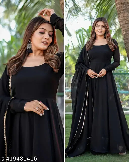 Black georgette dress gown, long sleeves, solid pattern, women's formal wear on mannequin