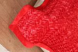 Red and black fabric with fringe details