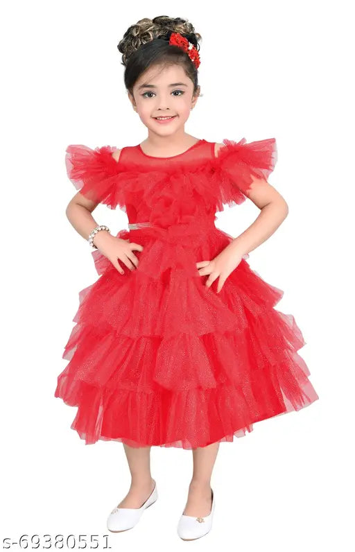 A red, ruffled, sleeveless dress with full skirt and lace collar