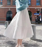 White viscose rayon skirt for women, solid net pattern, fashionable wear on model, various sizes from XS to XXL