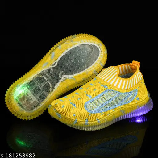 A yellow and green light-up casual shoe with a white sole for comfortable, lightweight wear