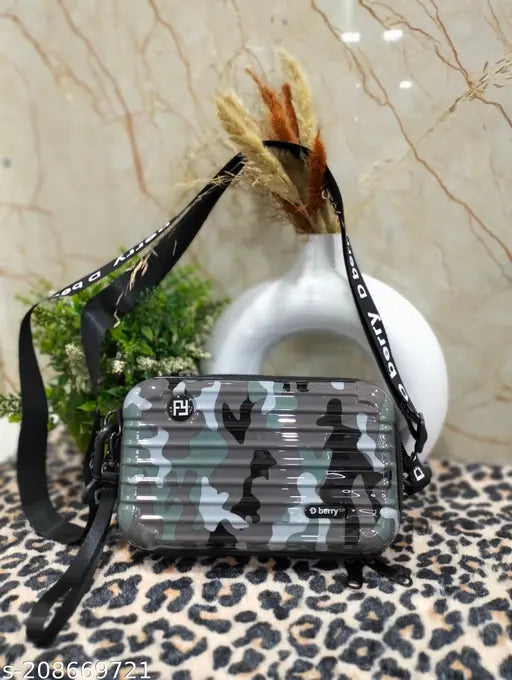 A box cross body bag with a camouflage pattern and an adjustable strap