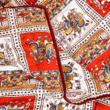 Red and yellow traditional Indian blanket with animal print design