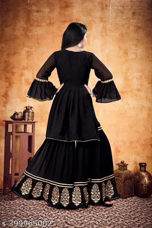 Black chiffon maxi gown with gold embroidery, flared sleeves, and layered skirt.