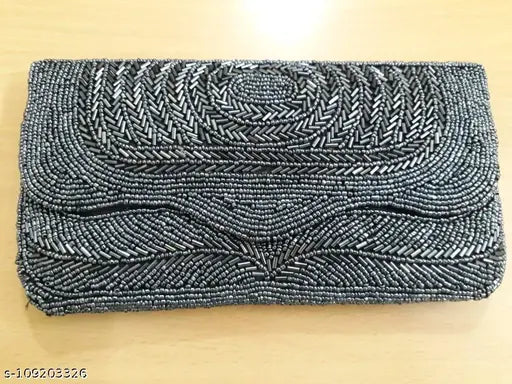 Gray and white patterned beaded clutch with metal hardware