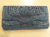 Gray and white patterned beaded clutch with metal hardware
