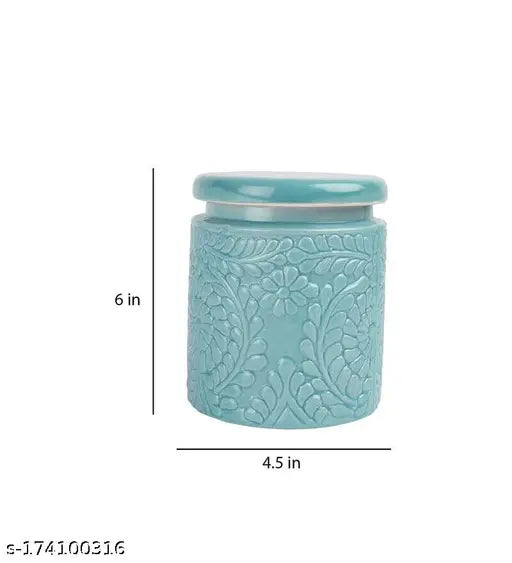 This is a ceramic handpainted jar, suitable for multiple uses such as kitchen storage or decoration. It has a lid and comes in two pieces. The jar itself is green with an off-white top, while the lid is solid green. The size of the jar is 1000 ml. Its design makes it functional and versatile