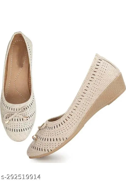 Tan, lace-up flats with wedge heels