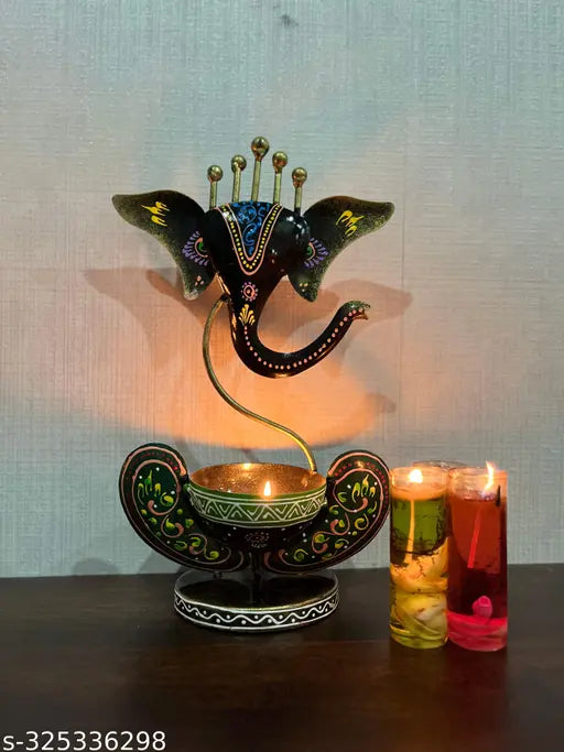 Metal painted Ganesha idol showpiece, intricate iron artwork for spiritual home decor, features Diya stand & T-light candle holder