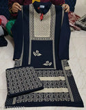 Plaid patterned suit jacket with a matching bottom piece and a pair of pajamas