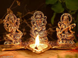 Metal Laxmi Ganesh Sarawati idol with diya set on kela leaf, Indian crafted for home or office Vastu, gifting luck and happiness. Size: 20x11x10 cm