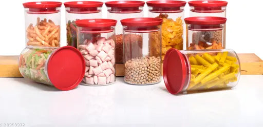 Airtight glass jars with red lids, stocked with various food items such as peanuts and carrots