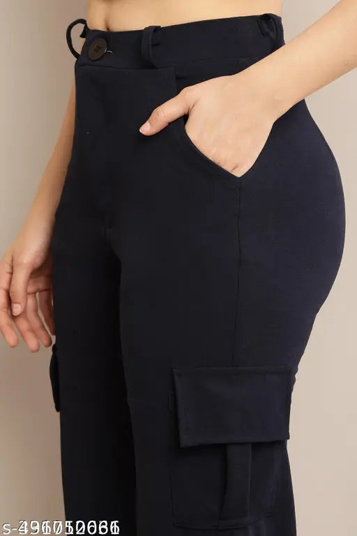 Black cargo pants with deep pockets and a visible zip fly