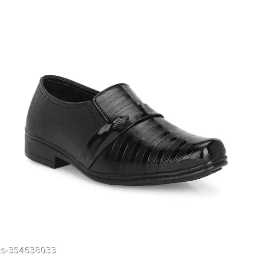 Black shoe with two straps, possibly velcro, on a white background