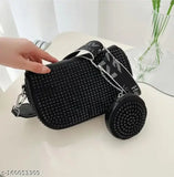 Black sling bag with metallic hardware and chain strap