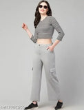 Gray cargo pants, white striped top, sunglasses