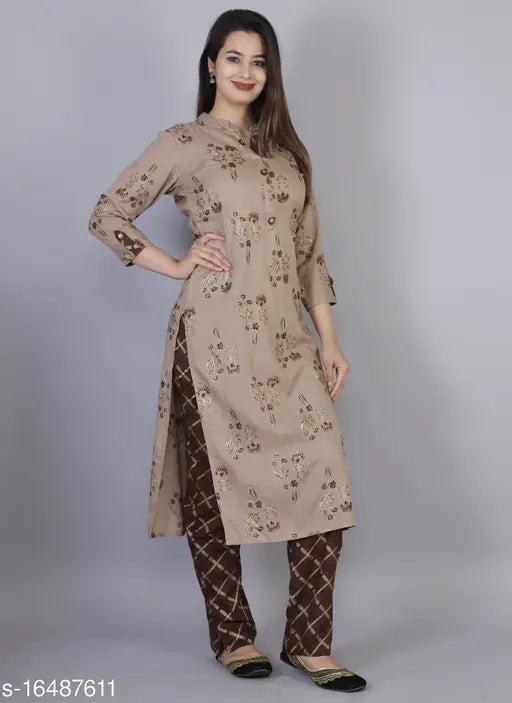 Women's printed brown rayon kurta pant set with three-quarter sleeves, single quantity, sizes M, L, XL, XXL. Indian ethnic wear on display stand