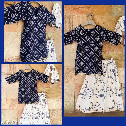 Bright vibrant Bandhani cotton kurti-skirt set with printed dupatta for girls, flared skirt and white jaal print on display