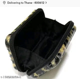 Black and yellow snakeskin patterned wallet with a zip closure