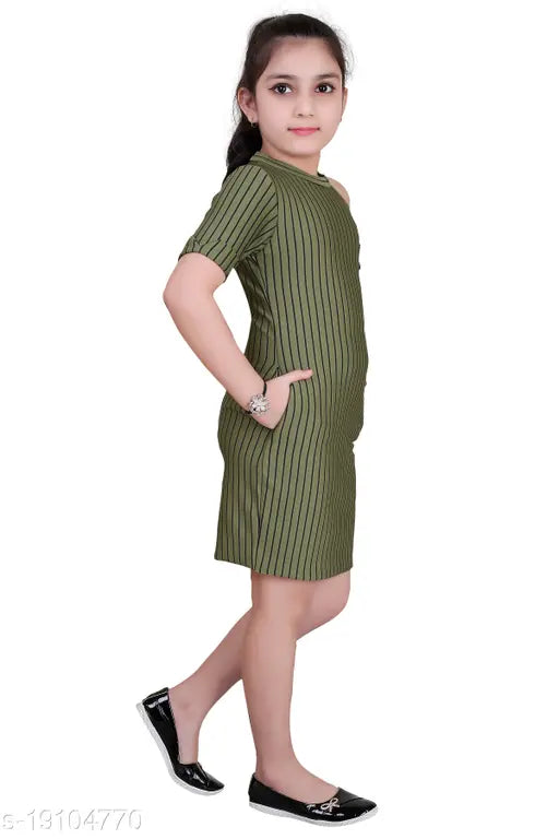 Woman in black sandals wearing a green striped shift dress
