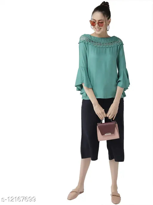 Green viscose rayon A-line top with three-quarter sleeves, solid design by Style Quotient for women. XS bust size: 33in, length size: 22in. Made in India