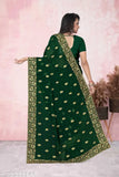 Green embroidered saree with pallu, worn with black blouse
