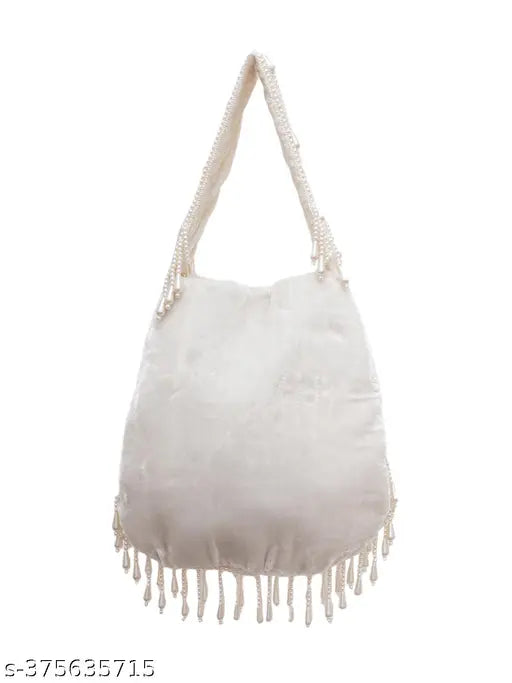 Off white purse with hand embroidery and fringe details