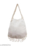 Off white purse with hand embroidery and fringe details