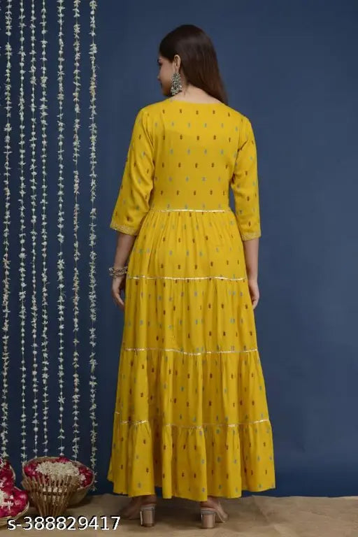 Voguish yellow patterned kameez, embroidered border with floral appliqué, long length