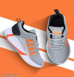 A pair of gray and orange sports shoes with a distinctive design