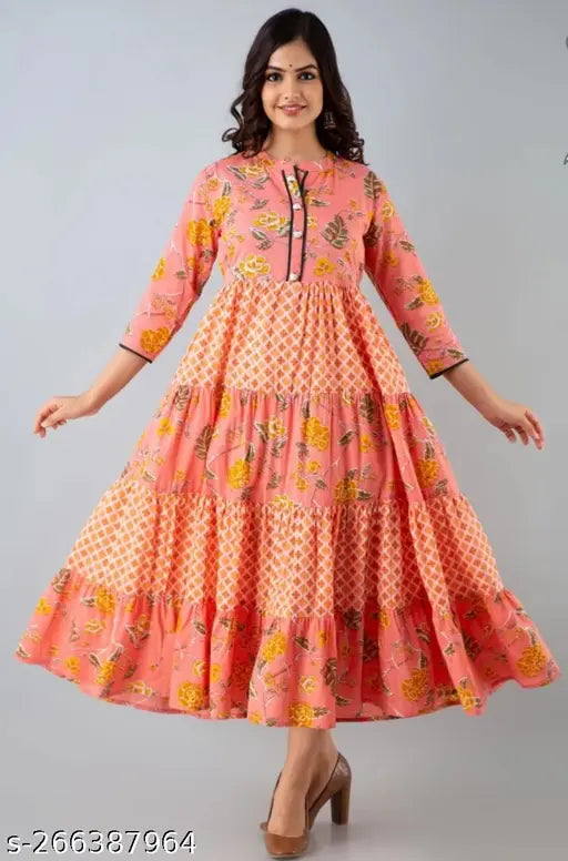Pink, flared kameez with embroidered design on a mannequin