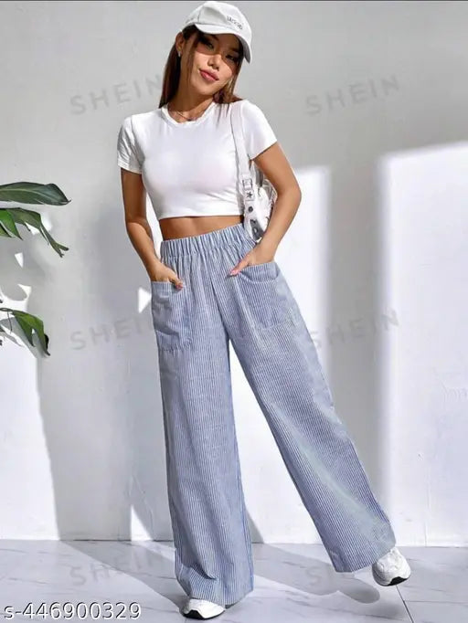 Blue denim jumpsuit with double pockets, black cropped top